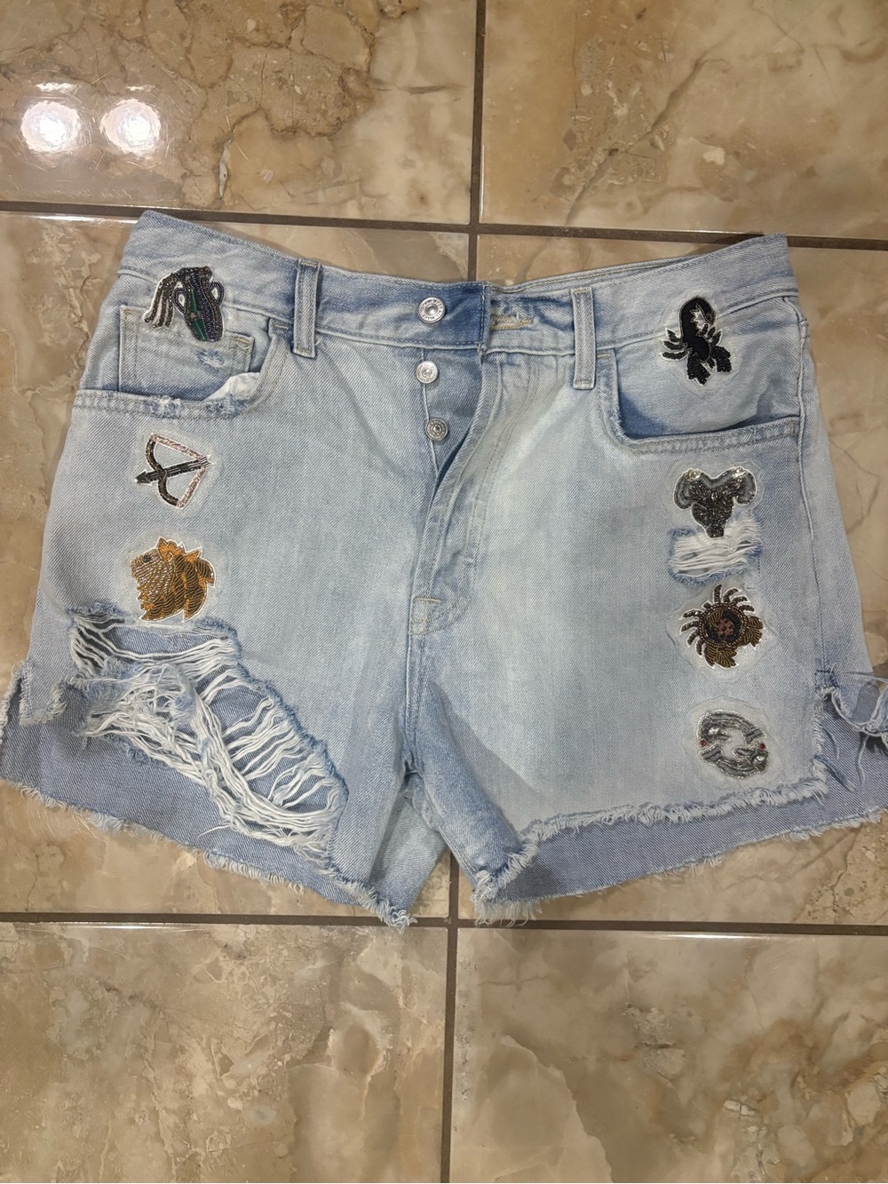 7 For All Mankind Light Blue Distressed Denim Shorts with Embroidered Patches